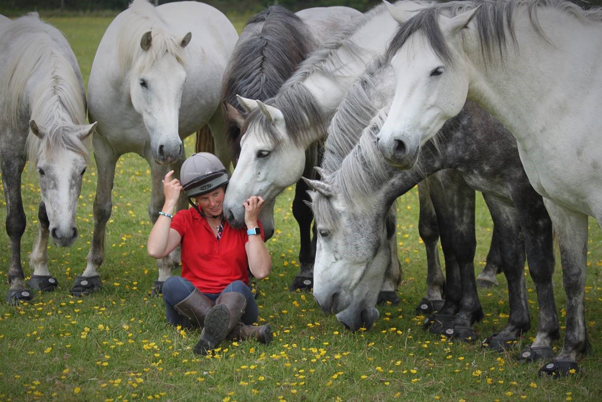Image of Emma Massingale with her liberty horses in their Cavallo Trek boots